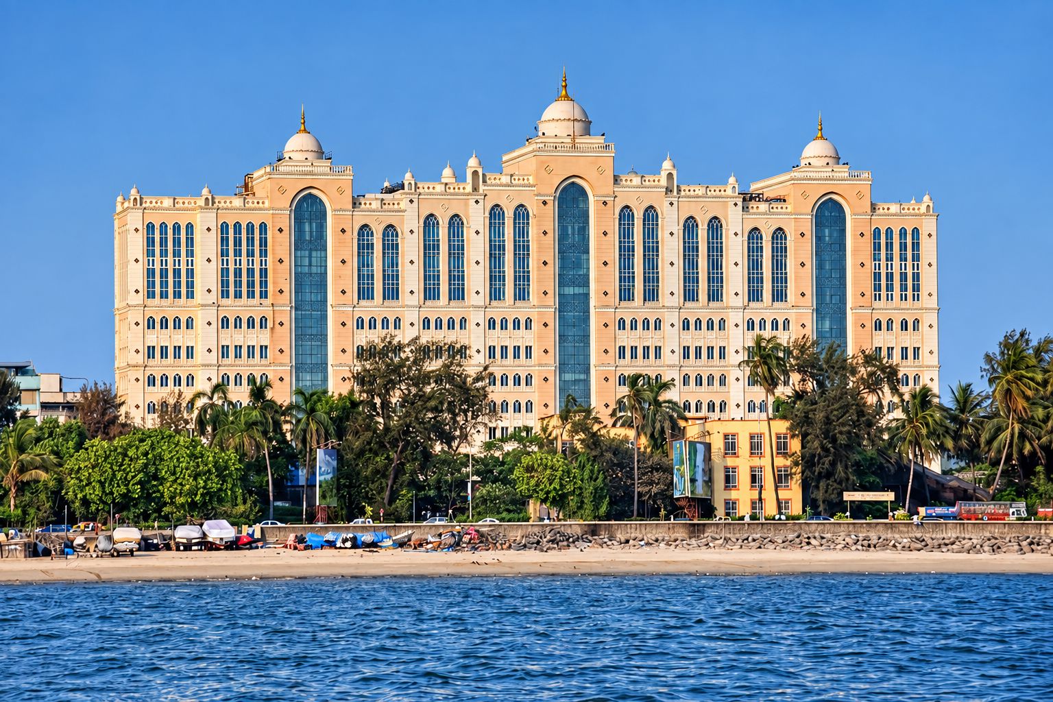 A domed sea-facing building on the Mumbai waterfront, seen from the water